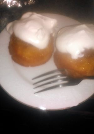 A picture of Mini pineapple upside-down cakes w/homemade whipped cream.