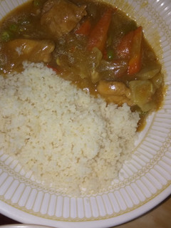 A picture of White rice and chicken veggie soup.