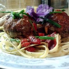 A picture of Giant stuffed kale meatballs.