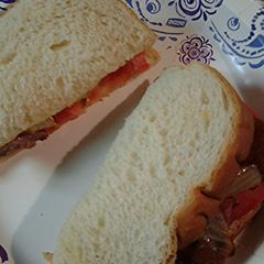 A picture of Sausage tomato sandwich.