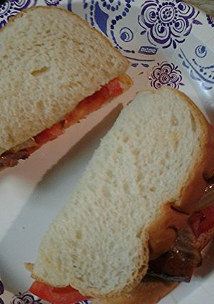 A picture of Sausage tomato sandwich.