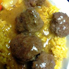 A picture of curry mini patties in sauce.