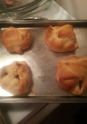 A picture of chicken and sausage in a blanket.