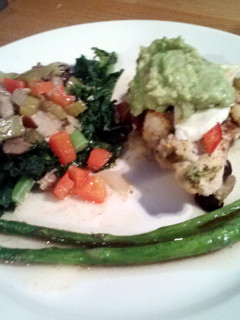 A picture of Garden Chicken with Marinated Fresh Mozeralla, Garlic Kale, butter seared Asparagus and Guacamole topping.