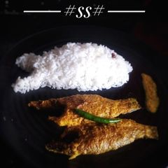 A picture of Whole Vetki fish curry with mustard & poppy seeds paste.