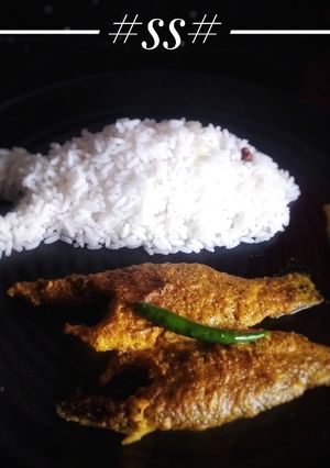 A picture of Whole Vetki fish curry with mustard & poppy seeds paste.
