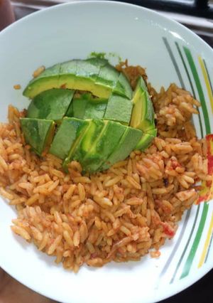 A picture of Jollof rice and Avacado.