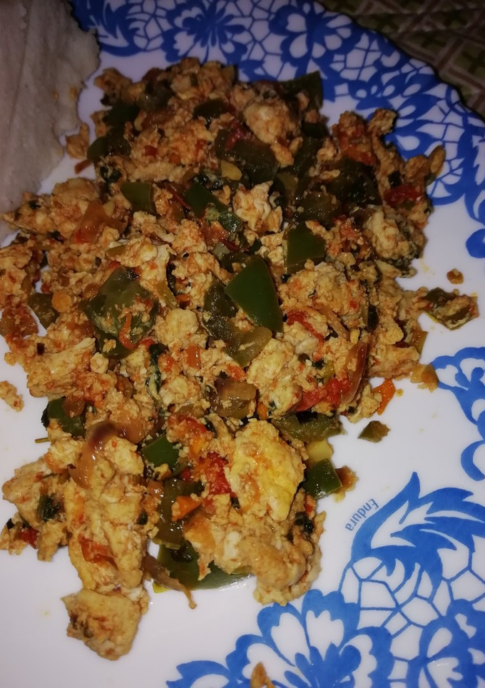 A picture of Scrambled eggs with veggies.