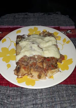 Una foto de Canelones rellenos con ricota y jamón