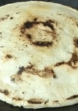 A picture of White sorghum chapati on clay tawa.