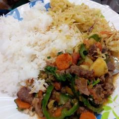 A picture of Boiled Rice served with beef stew.