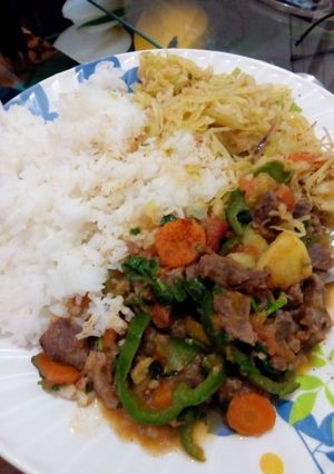 A picture of Boiled Rice served with beef stew.