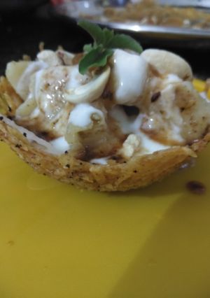 A picture of Lacha potato katori loaded with grains.
