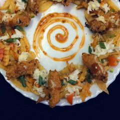 A picture of Crispy fried chicken and pizza fries.