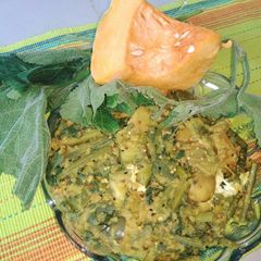 A picture of Pumpkin leaves with vegetables and moong dal.