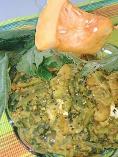 A picture of Pumpkin leaves with vegetables and moong dal.