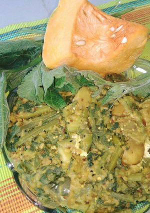 A picture of Pumpkin leaves with vegetables and moong dal.
