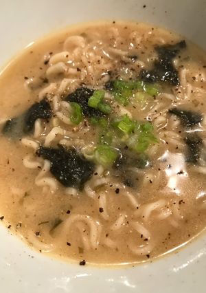 A picture of Miso Soup with Ramen Noodles.
