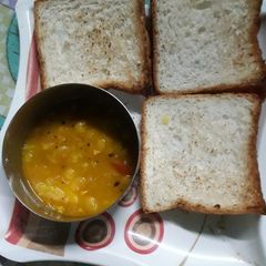 A picture of Bread toast and ghoogni.