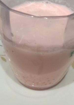 A picture of Sago milk with Rooh afza syrup.
