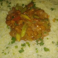 A picture of Chicken manchurian with garlic rice.