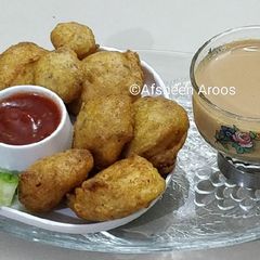 A picture of Egg Fritters with Tea.