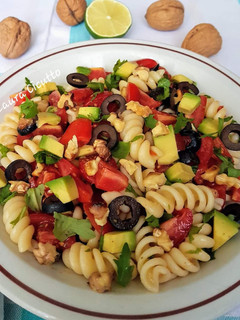 A picture of Cold Pasta with Avocado and Cherry Tomatoes.