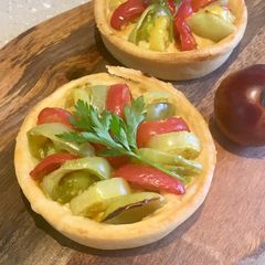 A picture of Mini Rainbow Tomato & Hummus Tarts.