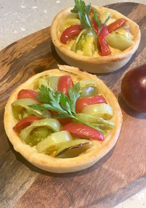 A picture of Mini Rainbow Tomato & Hummus Tarts.