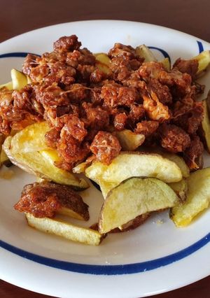 Una foto de Papas con chilli