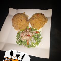 A picture of Jollof couscous wif salad.