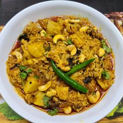 A picture of Muri Ghonto : Fish Head curry with Gobindobhog Rice.