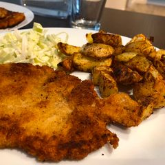 A picture of Chicken breasts in breadcrumbs.