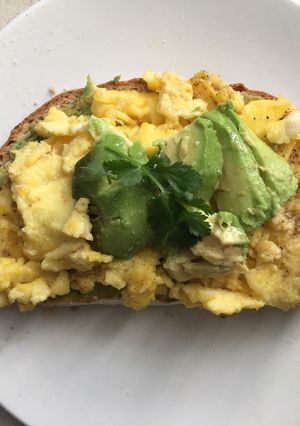 A picture of Creamy and delicious scrambled eggs on toast.