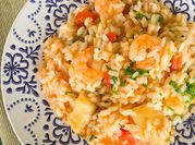 Uma foto de risoto bacalhau