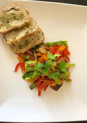 A picture of Stir fry green veggies & bread.