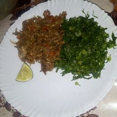 Fried omena with greens A picture of Fried omena with greens.