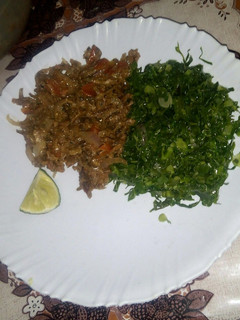 A picture of Fried omena with greens.