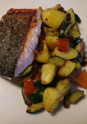 A picture of Pan fried salmon with sautéed veg.