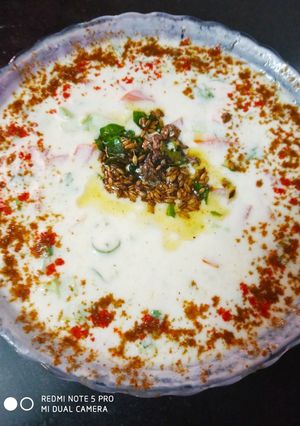 A picture of Tomato cucumber raita.
