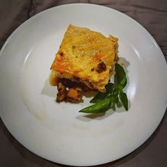 A picture of Baked pasta with ground beef.