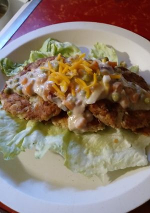 A picture of Creamed Tuna over Southwestern Potato Cakes.
