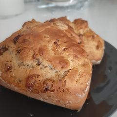 A picture of Banana bread with raisins and nuts.