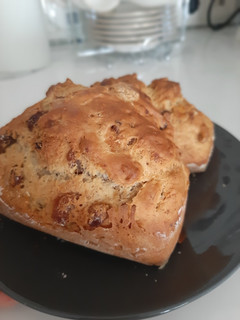 A picture of Banana bread with raisins and nuts.