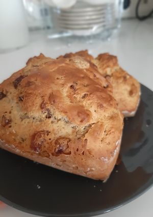 A picture of Banana bread with raisins and nuts.