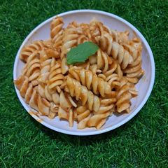 A picture of Fusilli Pasta with Arrabbita sauce.