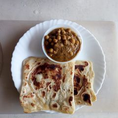 A picture of Maida chapati with chic peas gravy.
