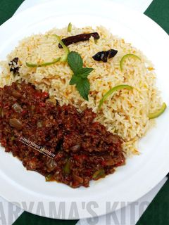 A picture of Nigerian carrot fried rice with minced meat soup.