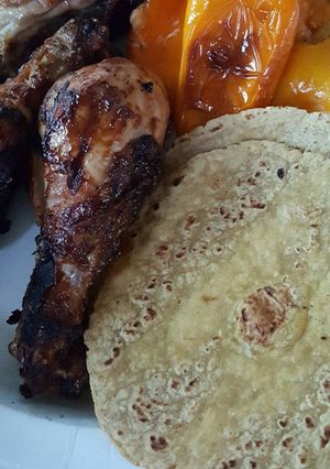A picture of Grilled Chicken Drums with Cheese Stuffed Mini Peppers.