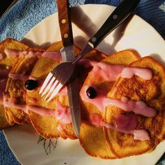 Soufflé pancakes topped with blueberry cream A picture of Soufflé pancakes topped with blueberry cream.